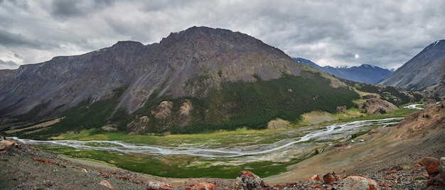 Hiking in the mountains Rivers and mountain lakes summer landscape of ridges and peaks An amazing journey