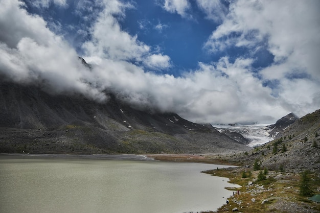 Hiking in the mountains Rivers and mountain lakes summer landscape of ridges and peaks An amazing journey