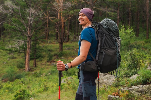 Hiking tourism adventure backpacker hiker man looking at beautiful view hiker tourist with backpack