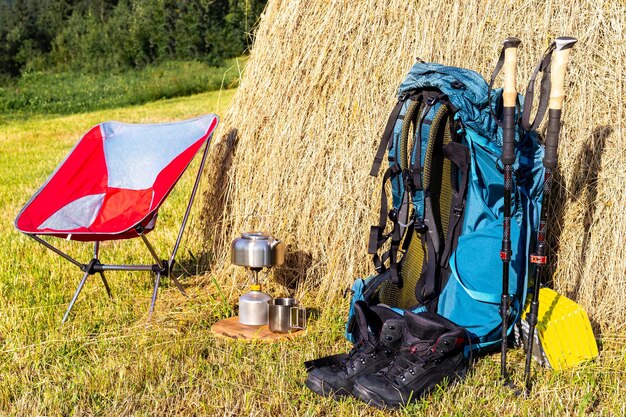 Photo hiking with a backpack and trekking poles in the mountains camping and trekking equipment