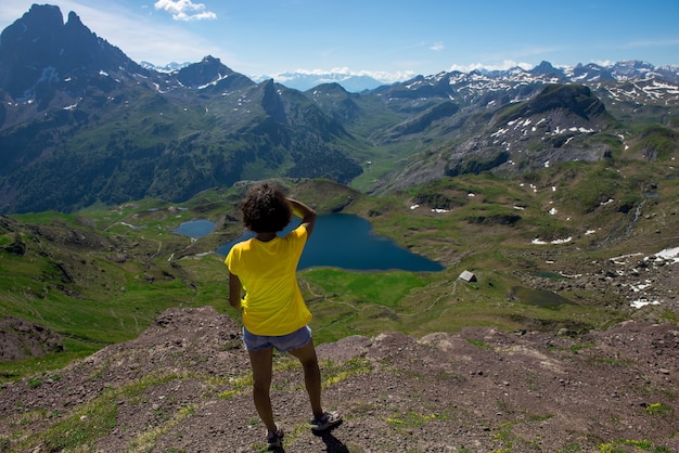 Hiking woman looking Pic du Midi Ossau in the French Pyrenees mountains