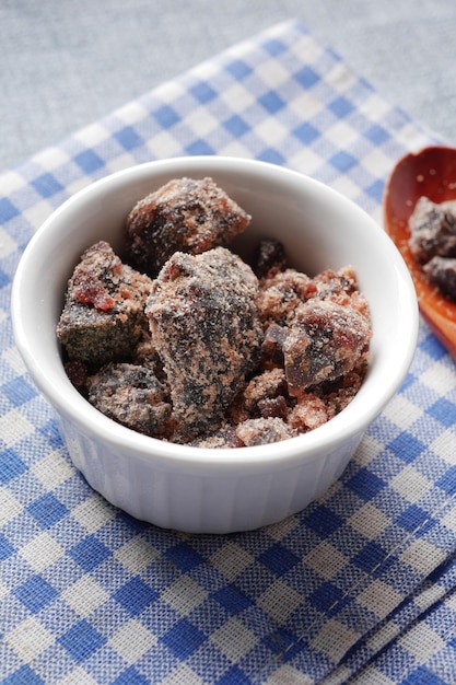 Himalayan black salt rock crystals Kala Namak in a container on table