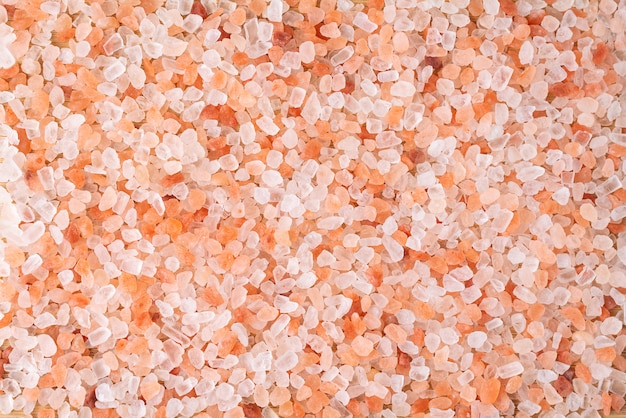 Himalayan pink salt crystals background, scrub spa therapy