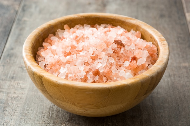 Himalayan salt in bowl on wooden table