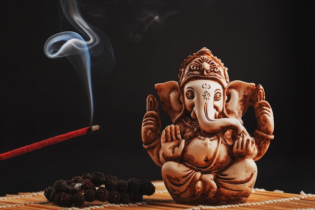 Hindu god Ganesh on black 