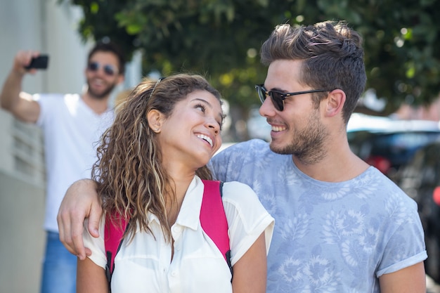 Hip couple looking at each other on the street