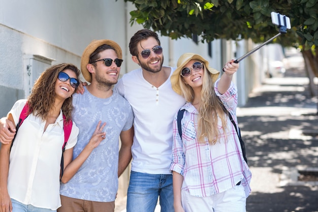 Hip friends taking selfie on the street