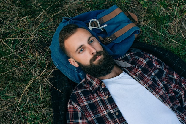 Hipster bearded man dream in forest