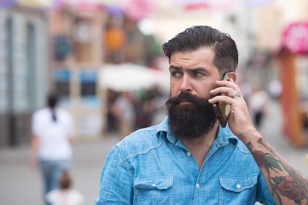 Hipster Businessman with Smart Phone while Walk outdoor Lifestyle of modern male Technology to Communicate in Business concept