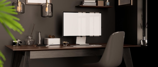 Hipster dark work studio with computer and accessories on wood table against the black wall