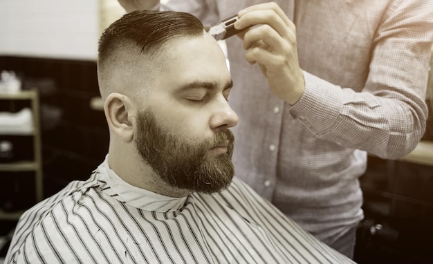 Hipster guy in barbershop