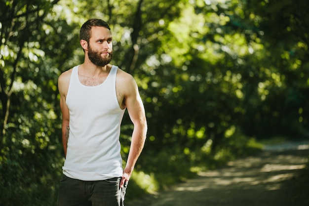 Hipster wearing white blank t-shirt with space for your logo