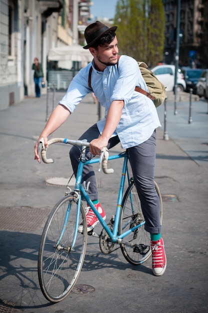 hipster young man on bike