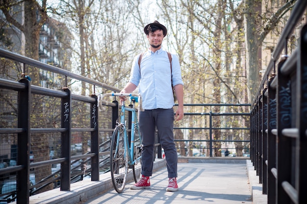 hipster young man on bike