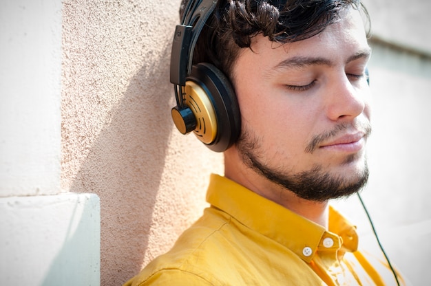 hipster young man listening to music