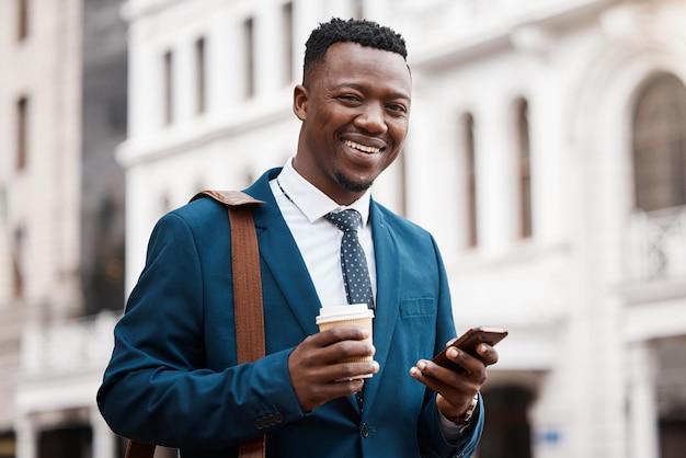 His device keeps him connected Shot of a content businessman using his smartphone to send a text while in the city