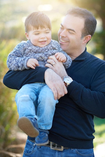 Photo his happiness is what i care about the most cropped shot of a father bonding with his little boy outside