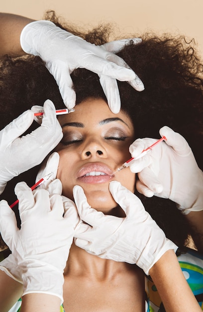 Hispanic Latino Woman, Getting Facial Skin Lifting Treatment, Injections