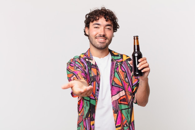 Hispanic man with beer smiling happily with friendly, confident, positive look, offering and showing an object or concept