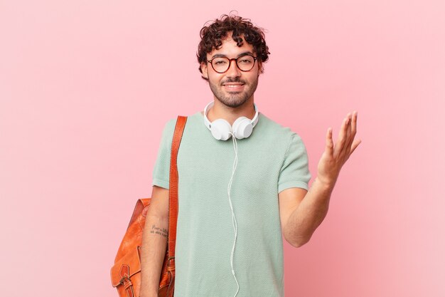 Hispanic student feeling happy, surprised and cheerful, smiling with positive attitude, realizing a solution or idea