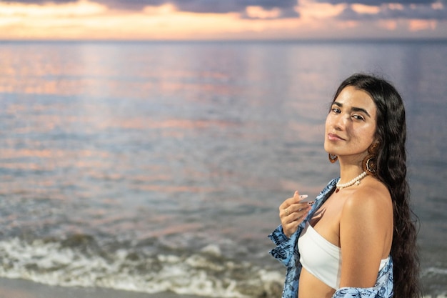 Hispanic Woman enjoying the stunning view of sunset