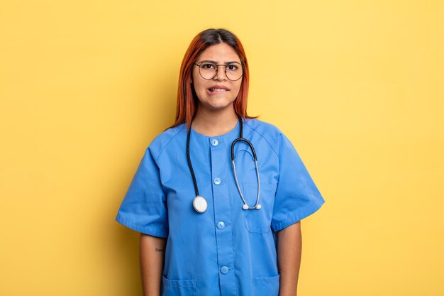 Hispanic woman looking puzzled and confused nurse concept