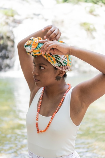 Hispanic Woman putting a turban on her headWoman putting a turban on her head