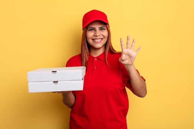 Hispanic woman smiling and looking friendly showing number four take away deliver concept