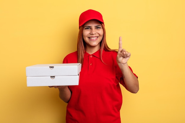 Hispanic woman smiling and looking friendly, showing number one. take away deliver concept