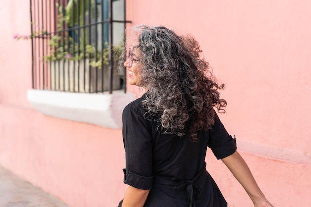 Hispanic Woman Walking Down The Street