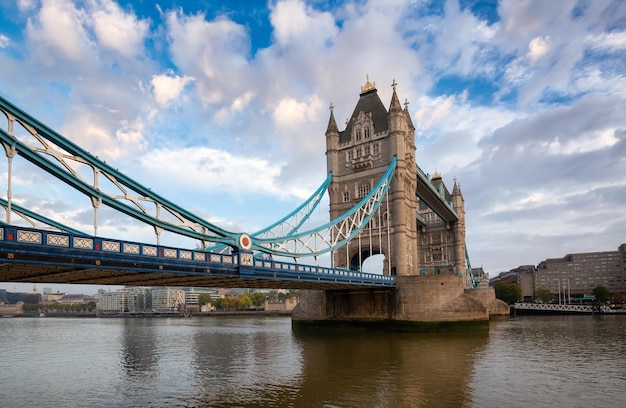 Historic Bridge over River Thames and Cityscape Skyline during dramatic sunrise