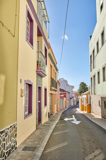 Historical city street view of residential houses in small and narrow alley or road in tropical Santa Cruz La Palma Spain Village view of vibrant buildings in popular tourism destinations overseas