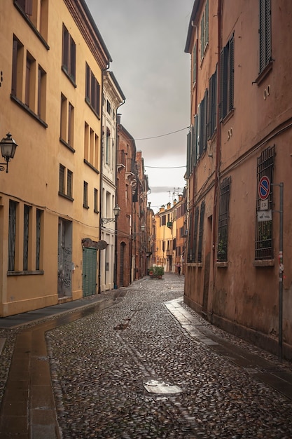 An historical empty alley in the historical city center of Ferrara in Italy