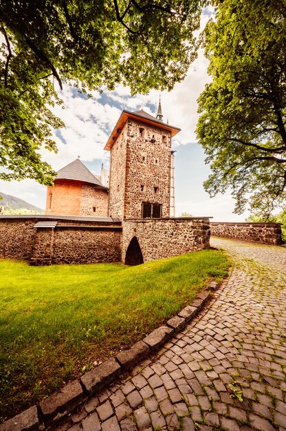 Historical town square in mining city Kremnica in Slovakia The outlook to castle and St Catherine church in the town