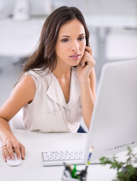 Hmm, this seems a bit problematic. An attractive young businesswoman working on solving a problem.