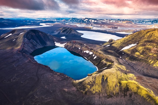 Hnausapollur or Blahylur volcano crater with blue pond on Icelandic highlands in the sunset on summer at Iceland