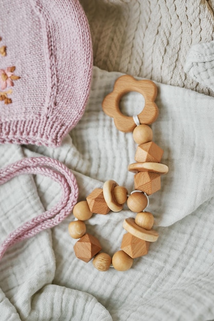 Hobbies and handicrafts. Knitted beanie with handmade embroidery. Wooden toys, rattles, teethers, nipple holder. Baby development, fine motor skills. Children and newborn products and accessories.