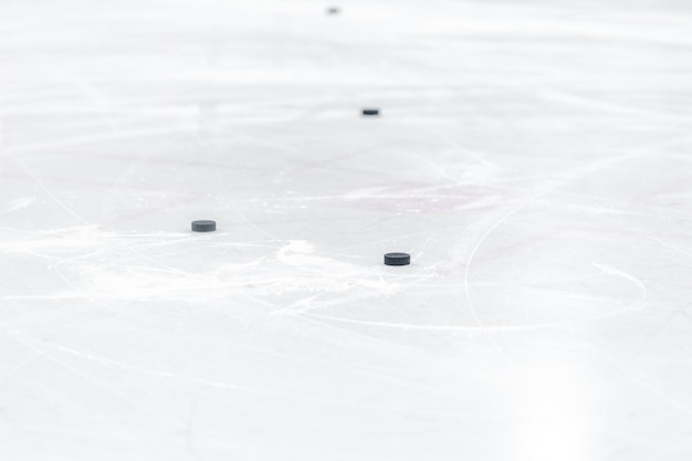 Hockey puck on the ice of the winter stadium