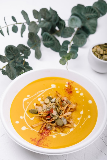 Hokkaido or butternut pumpkin soup with curry and seeds