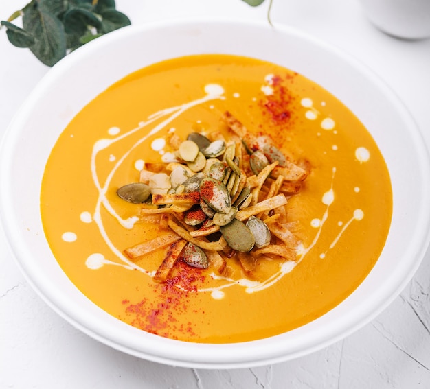 Hokkaido or butternut pumpkin soup with curry and seeds