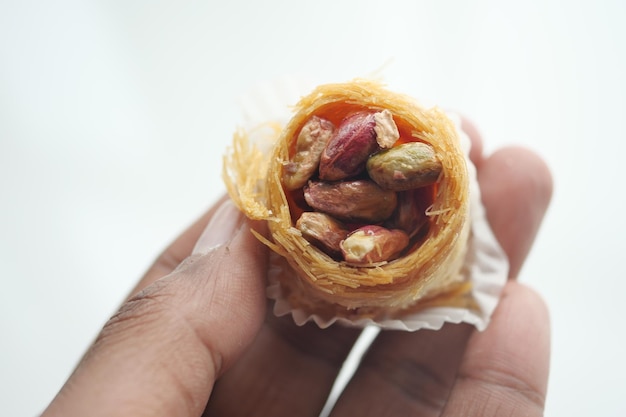 Holding a arabic dessert baklava