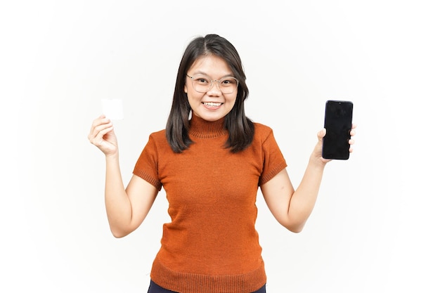 Holding Blank Bank Card and Smartphone With Blank Screen Of Beautiful Asian Woman Isolated On White