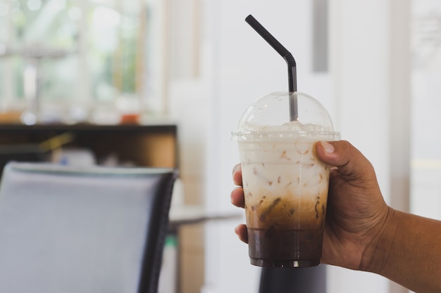 Holding coffee in a coffee shop