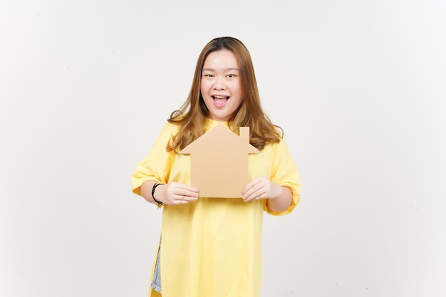 Holding Cutout House of Beautiful Asian Woman wearing yellow TShirt Isolated On White Background