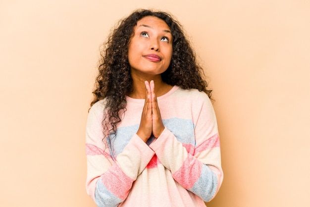 Holding hands in pray near mouth feels confident