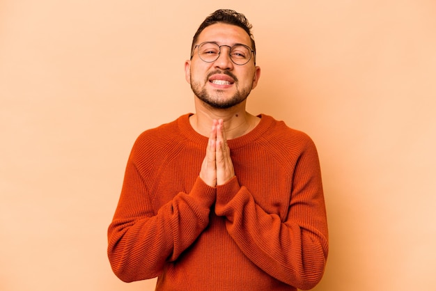 Holding hands in pray near mouth feels confident