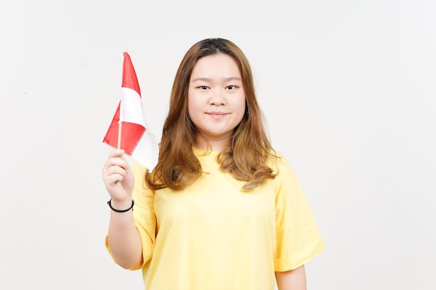 Holding Indonesian Flag Independence of Indonesia of Beautiful Asian Woman wearing yellow TShirt