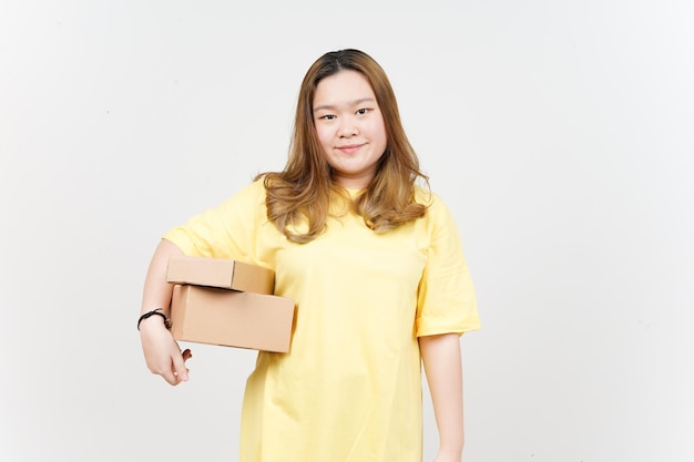 Holding Package Box or Cardboard Box of Beautiful Asian Woman wearing yellow TShirt