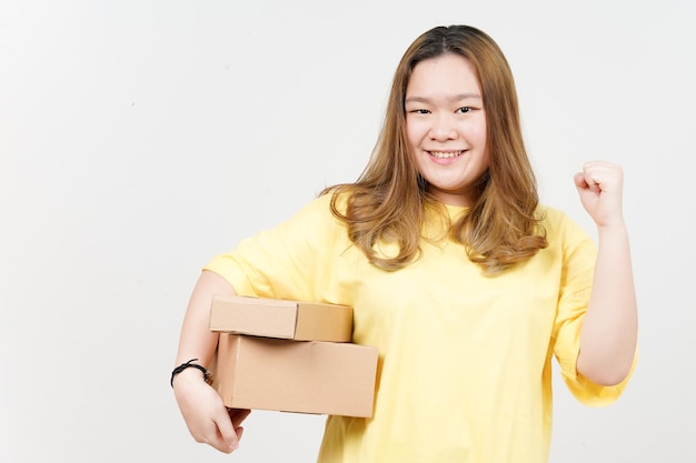 Holding Package Box or Cardboard Box of Beautiful Asian Woman wearing yellow TShirt