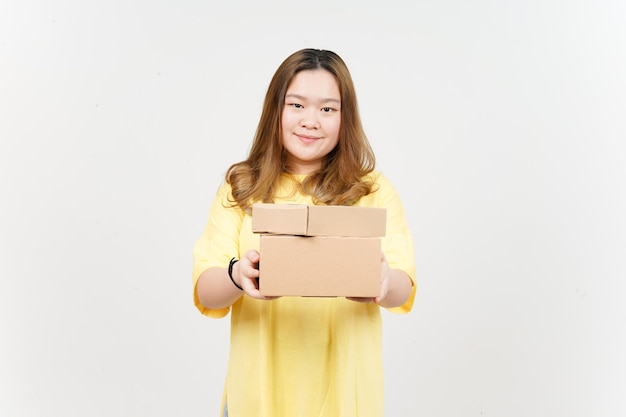 Holding Package Box or Cardboard Box of Beautiful Asian Woman wearing yellow TShirt